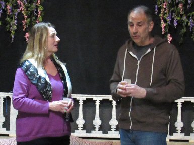 a woman and a man conversing